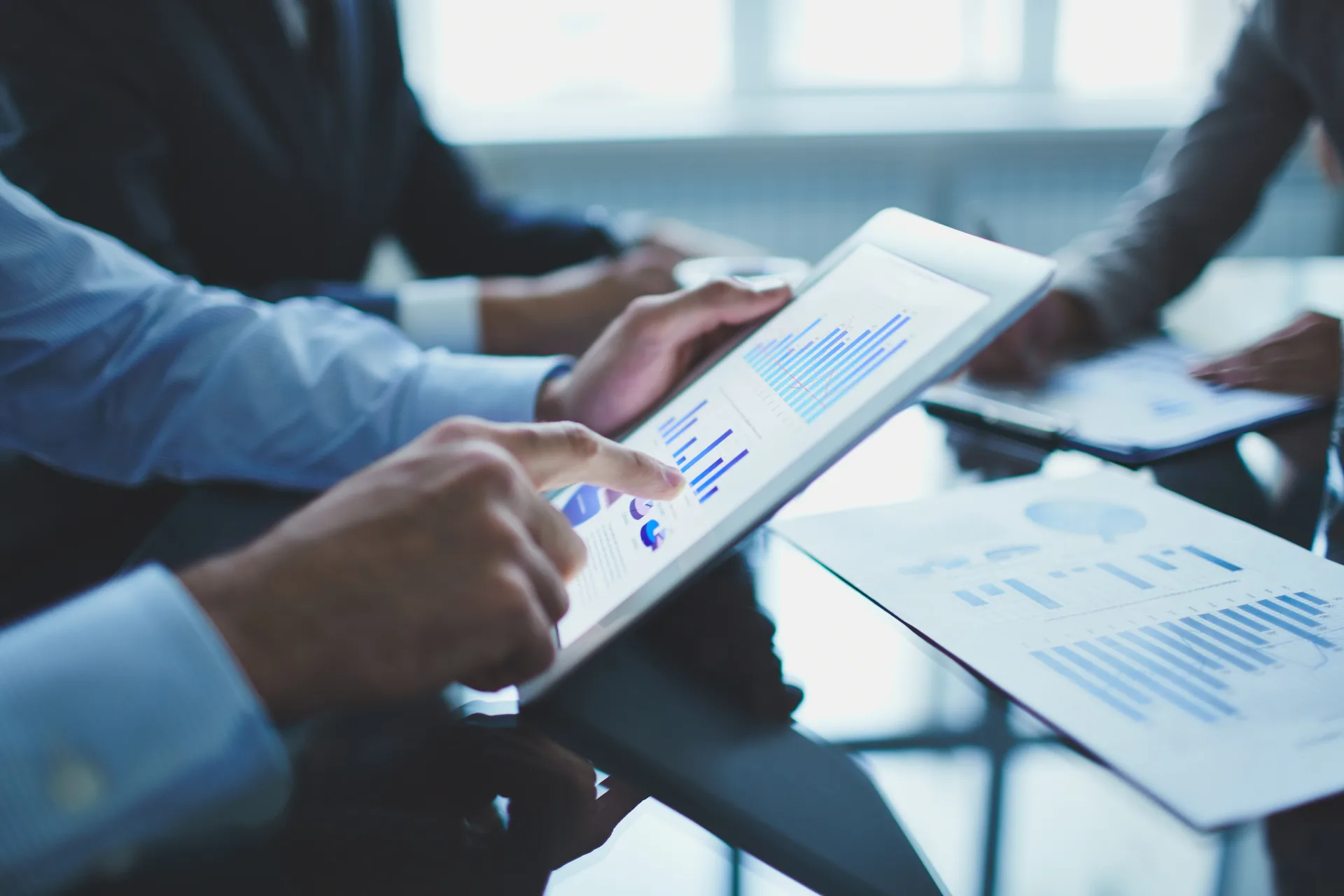 What Is Predictive Analytics? How Marketers Anticipate Customer Needs and Drive Growth 3 Image shows a man holding an iPad that has predictive Marketing analytics.